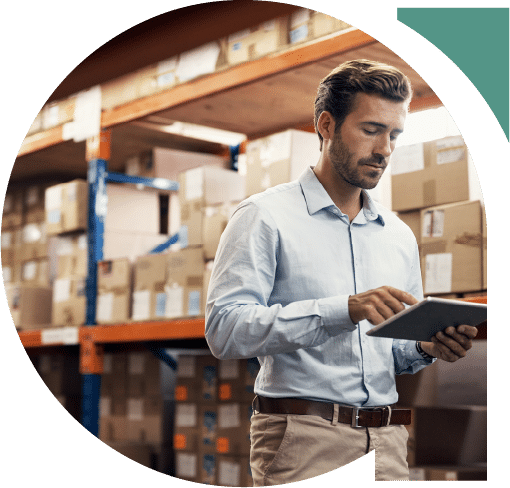 Man in a warehouse using a tablet